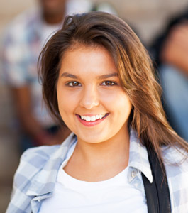 Smiling female student poses