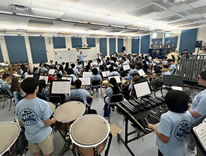 A band practicing in a classroom