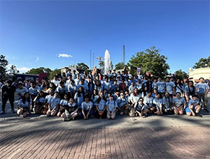 band students in front of a fountain